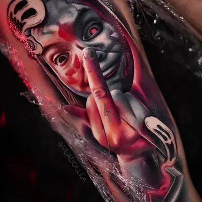 Color realism portrait tattoo: a grinning young woman raising her middle finger, with red washes and white graffiti-style smiley faces around her, photographed fresh under wrap.