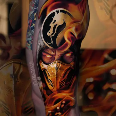 Color realism thigh piece of Scorpion from Mortal Kombat, gold mask in flames under the dragon crest.