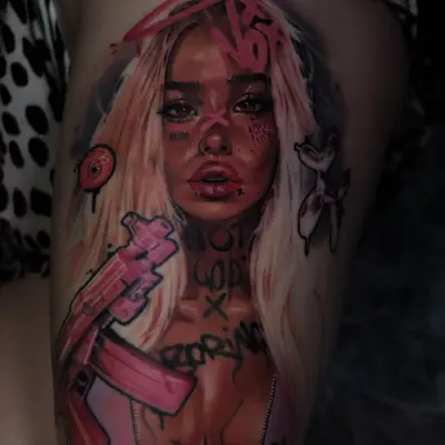 Color realism tattoo on the thigh: a blonde woman with a pink halo holding a pink rifle, with hot pink graffiti marks across her face and body.