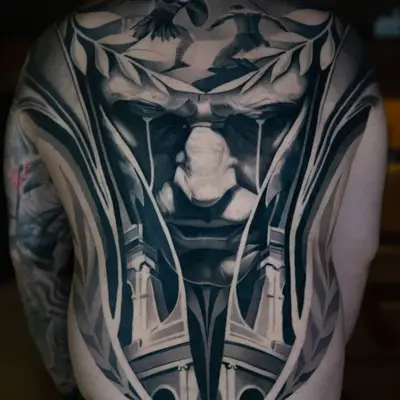 Black and grey realism back piece of Julius Caesar framed by Colosseum arches