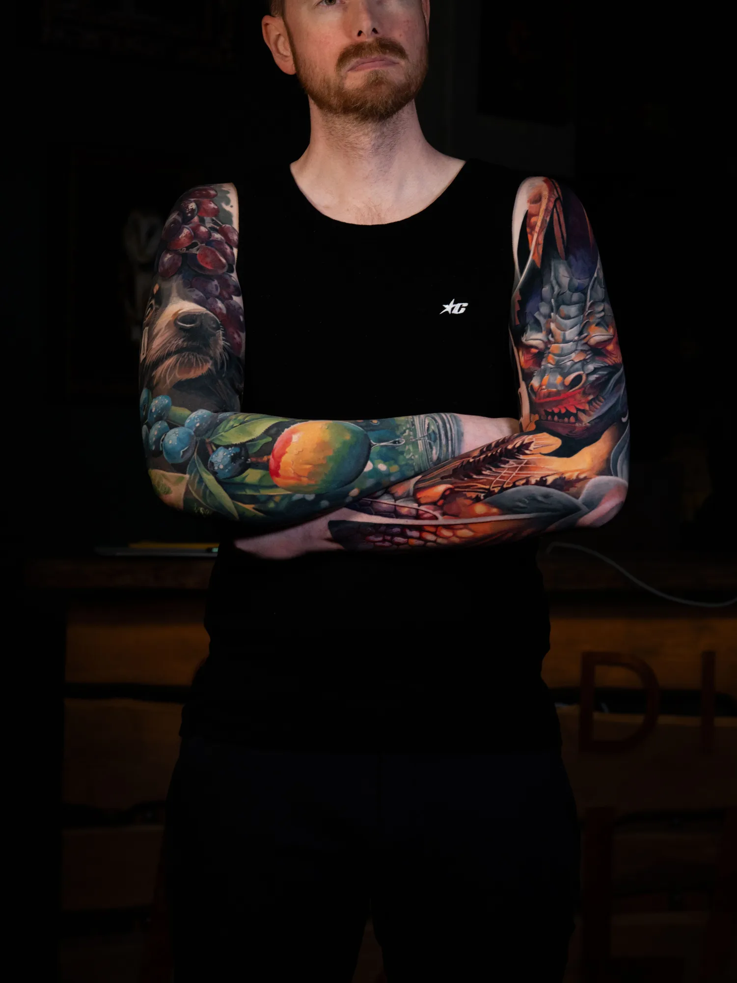 Collector wearing two full color realism sleeves of fruit, animals and a dragon