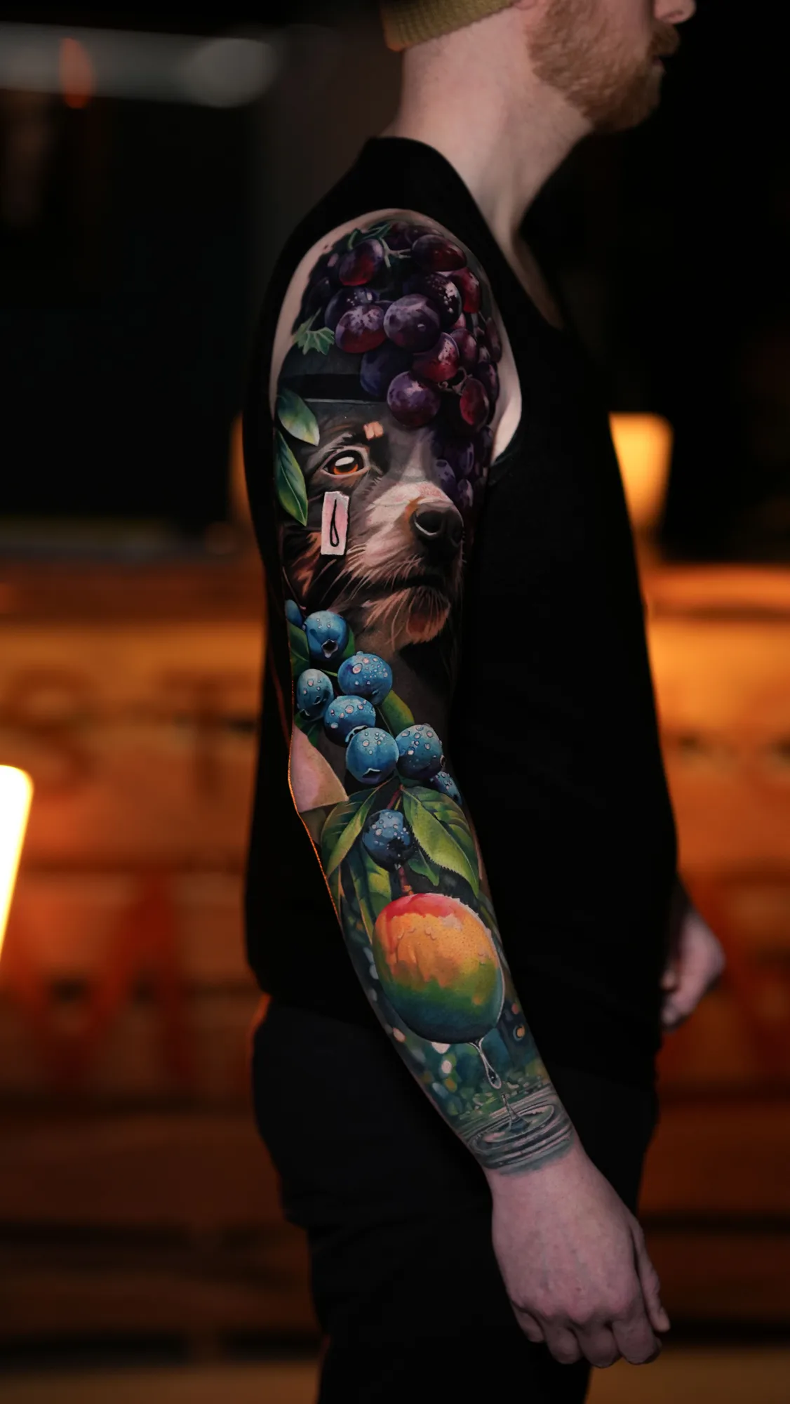 Color realism full sleeve of fruit and a dog that covers an older shoulder tattoo