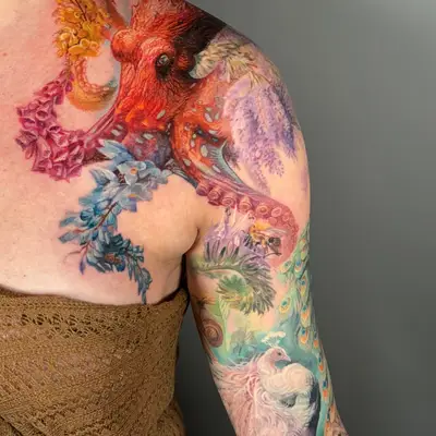 Colorful octopus and floral tattoo on shoulder and arm.