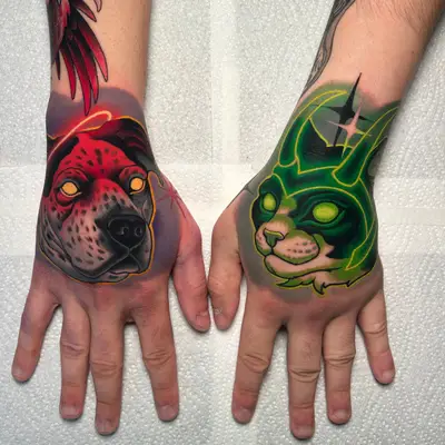 Colorful tattoo featuring a dog and a cat on hands.