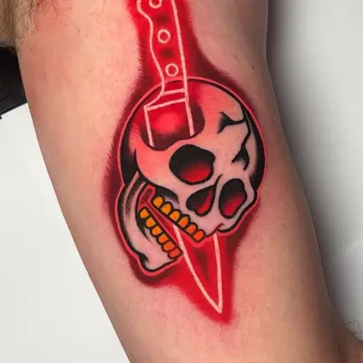 Skull with a knife through it, featuring bold colors and shading.
