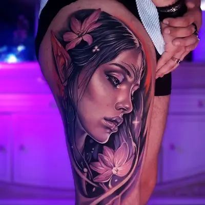 Color portrait of a elvish woman with flowers on thigh tattoo.
