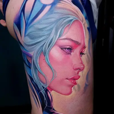 Color neorealist profile portrait of Daenerys Targaryen with pale blue and silver hair against blue shapes and a pale moon, tattooed on the outer thigh.