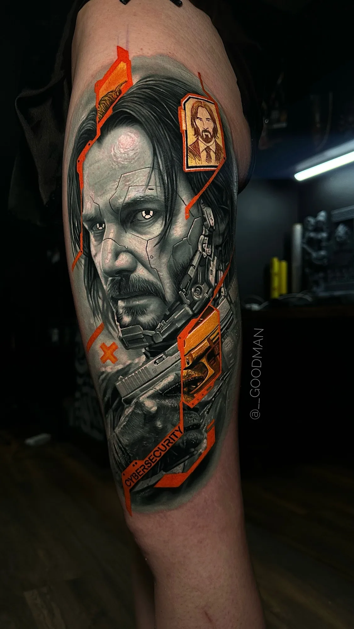 Realistic cyberpunk tattoo of Keanu Reeves in black and grey with pops of orange color.